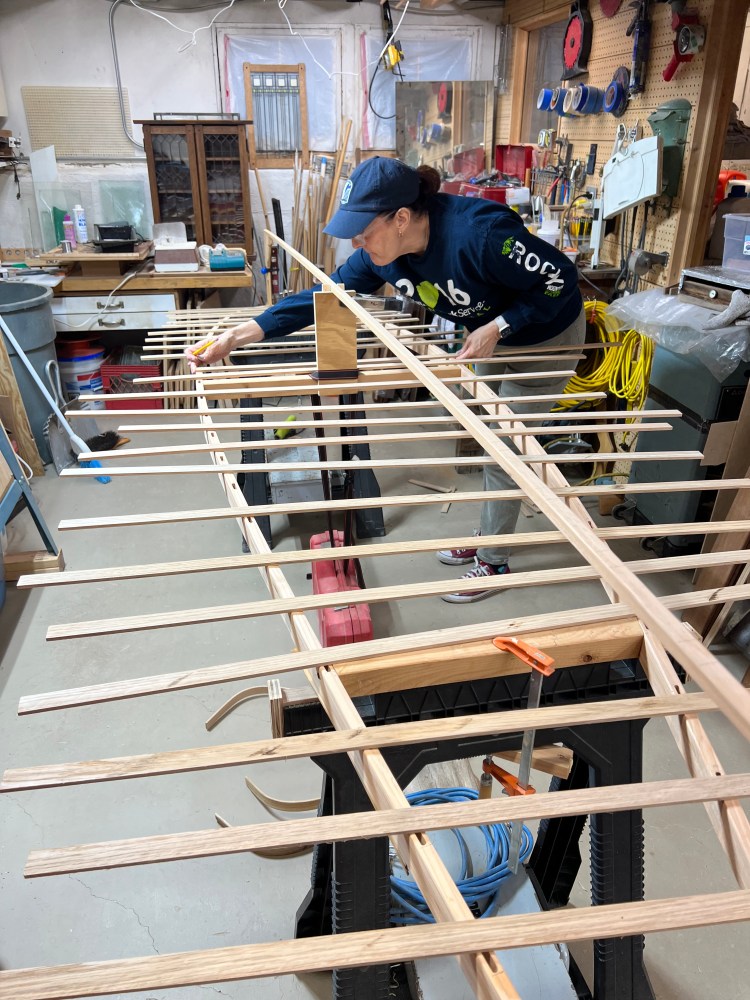 Image of Aleca prepping ribs on her canoe.
