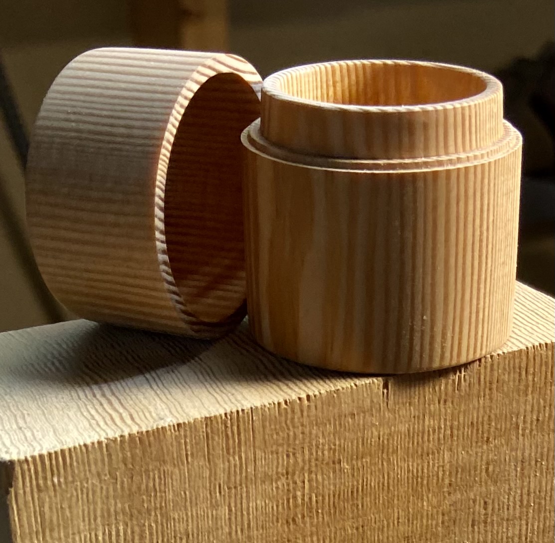 Image of a douglas fir box with the lid set to the side.