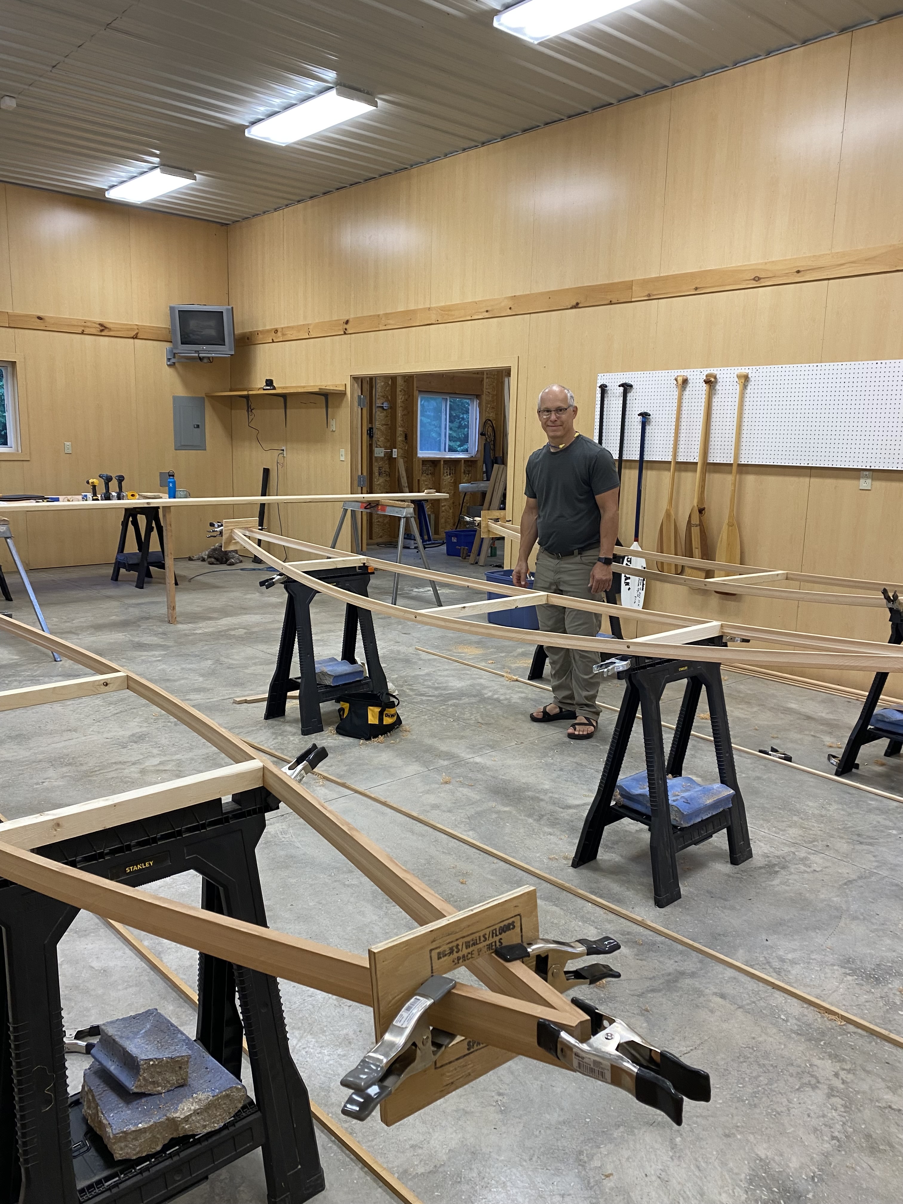 Image of a woodshop at the start of building canoes with teacher David LaPaglia.