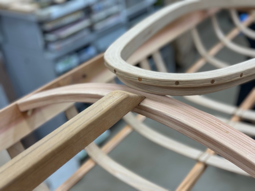 Image of wooden kayak curve details.